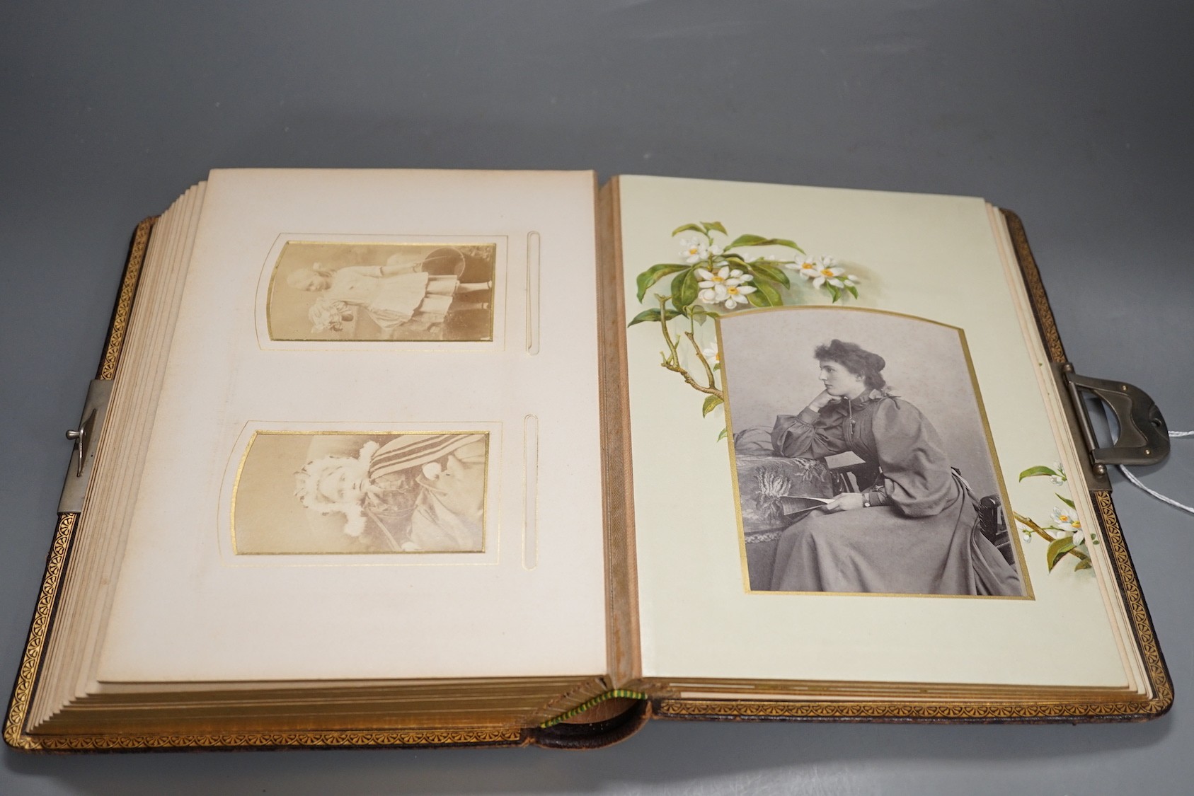 A late Victorian Morocco leather album of cabinet card photo portraits